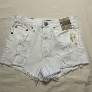 Aero white high waisted distressed shorts.